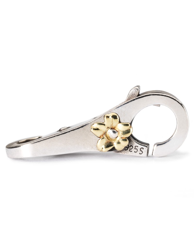 Auksinė Gėlelė, Užsegimas